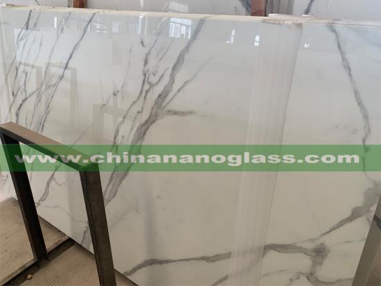 Exquisite and unique Calacatta Nano Glass with its clean whites and striking marble look vein