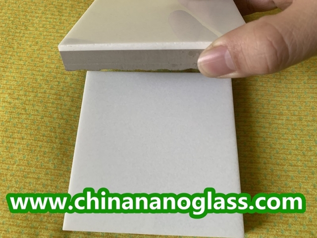 Composite marmoglass nanoglass tiles with porcelain backing